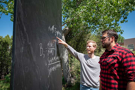 Man pointing at a blackboard. Link to Tangible Personal Property